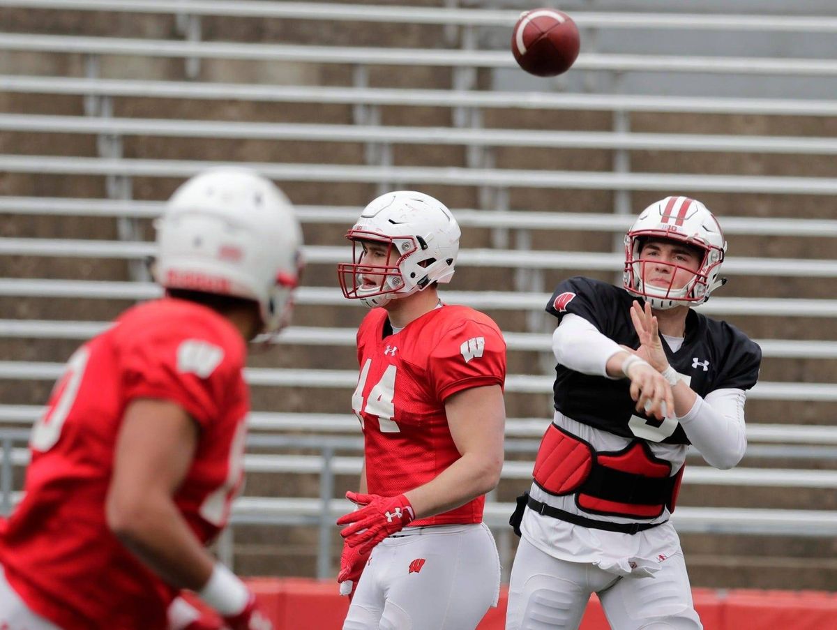 Wisconsin Badgers quarterback Graham Mertz (5) finds an open receiver
