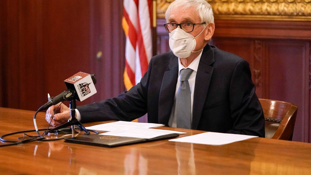 Wisconsin Gov. Tony Evers, a member of Wisconsin's Electoral College, casts his vote for the presidential election at the state Capitol on December 14, 2020 in Madison, Wisconsin.