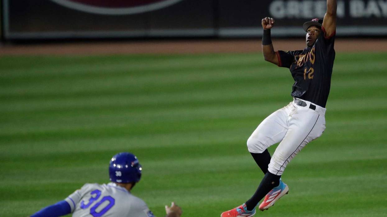 Wisconsin Timber Rattlers' Jesus Made (12) makes a leaping catch during their baseball game against the Quad Cities River Bandits Wednesday, August 27, 2025, at Neuroscience Group Field at Fox Cities Stadium in Grand Chute, Wisconsin. Quad City won 9-5.