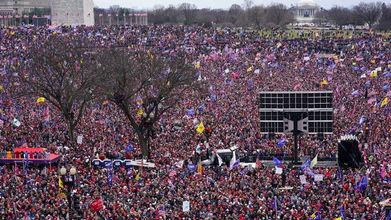 With the Washington Monument in the background, people attend a rally in support of President Donald Trump near the White House on Wednesday, Jan. 6, 2021, in Washington. (AP Photo/Jacquelyn Martin)