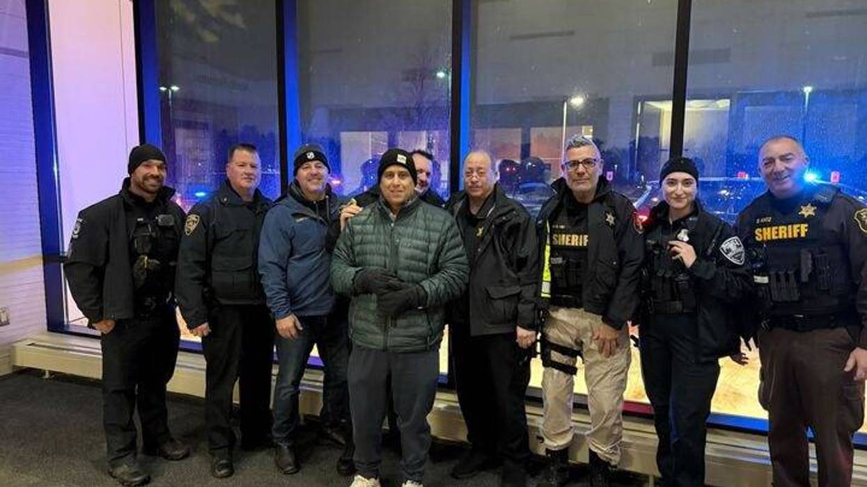 Wolverine Lake Police Sgt. John Marasco with other officers