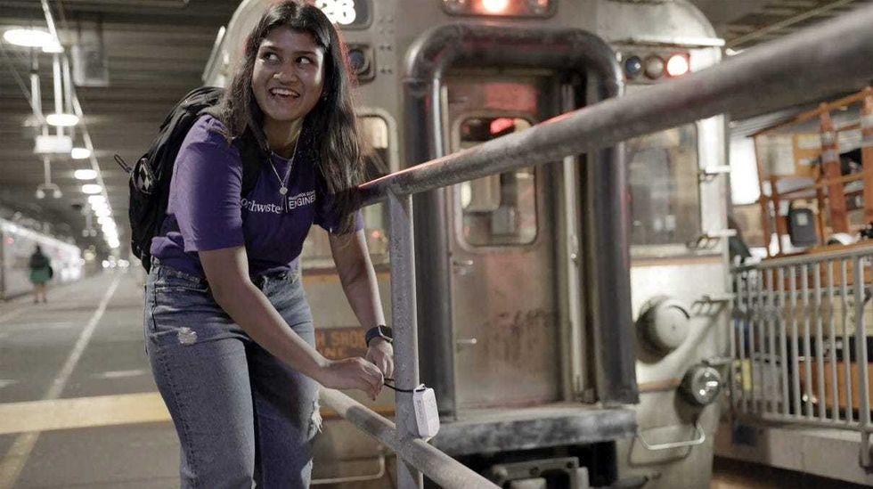 woman attaches sensor in Loop basement