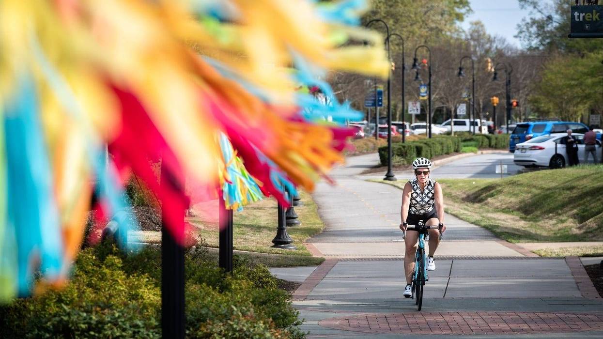 Woman Bikes in Travelers Rest