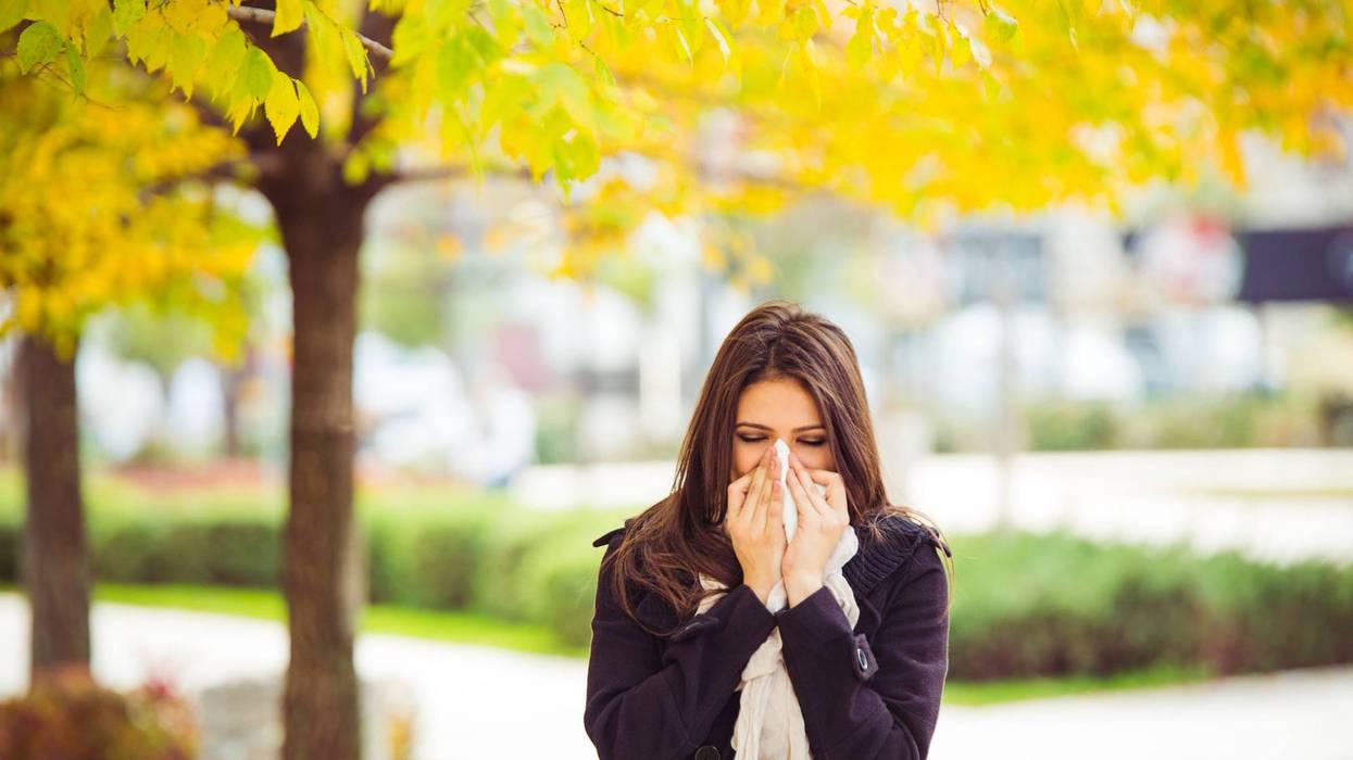 Woman blowing her nose