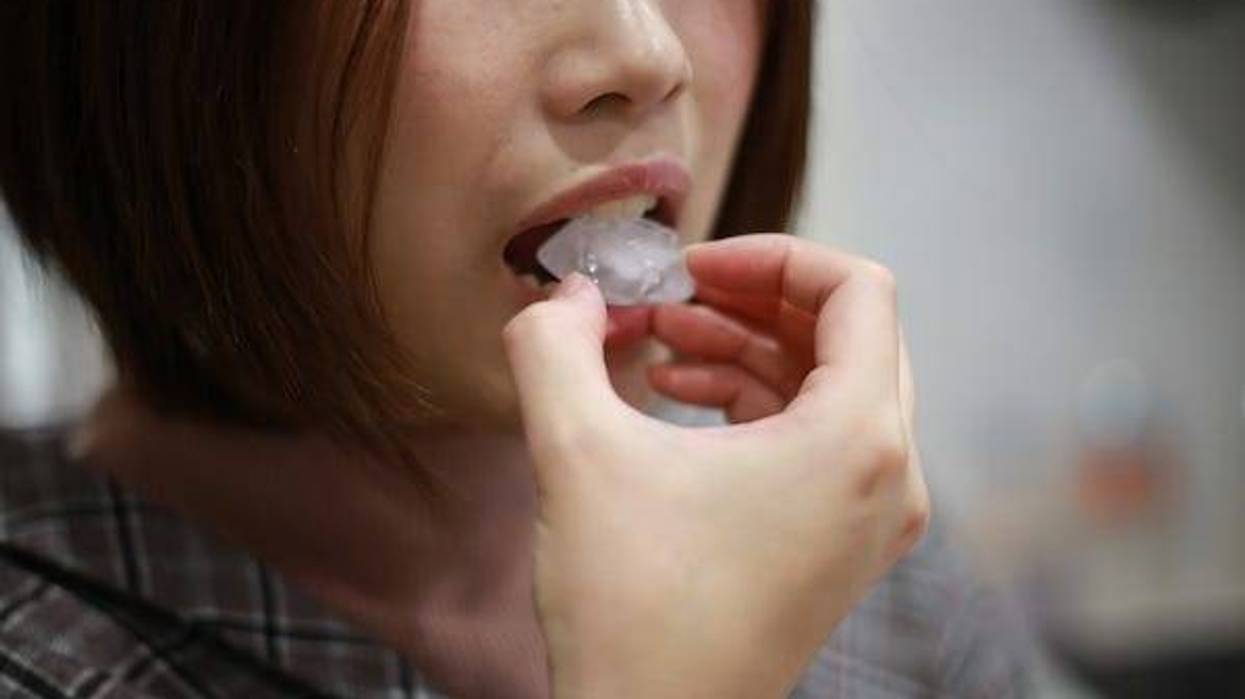 Woman eating an ice cube