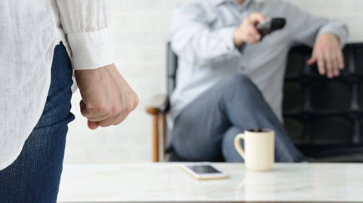 Woman frustrated with husband watching tv