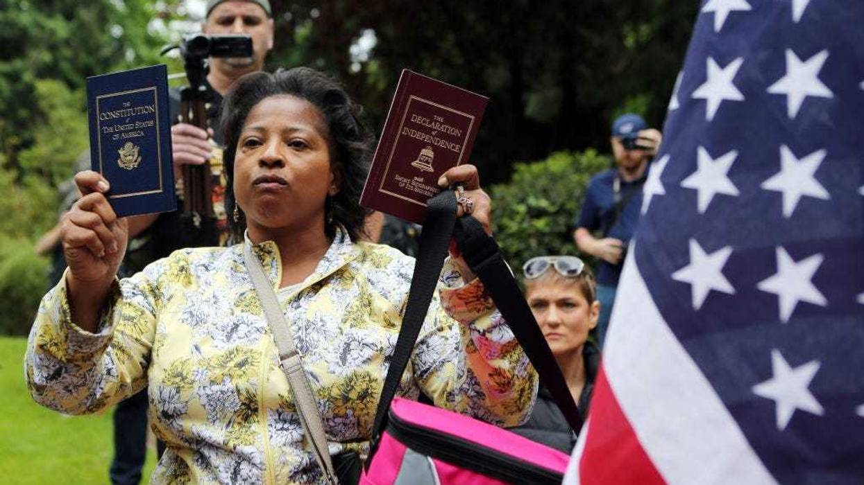 Woman holding Constitution and Declaration