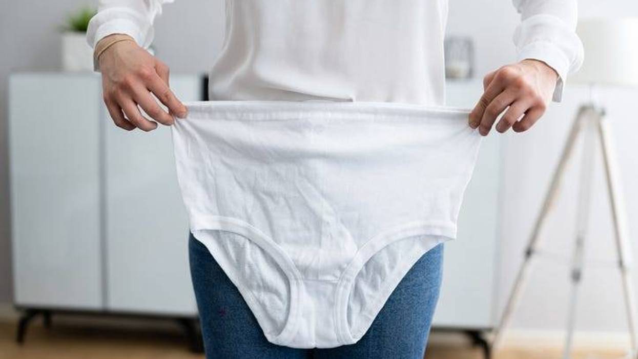Woman Holding Granny Underwear