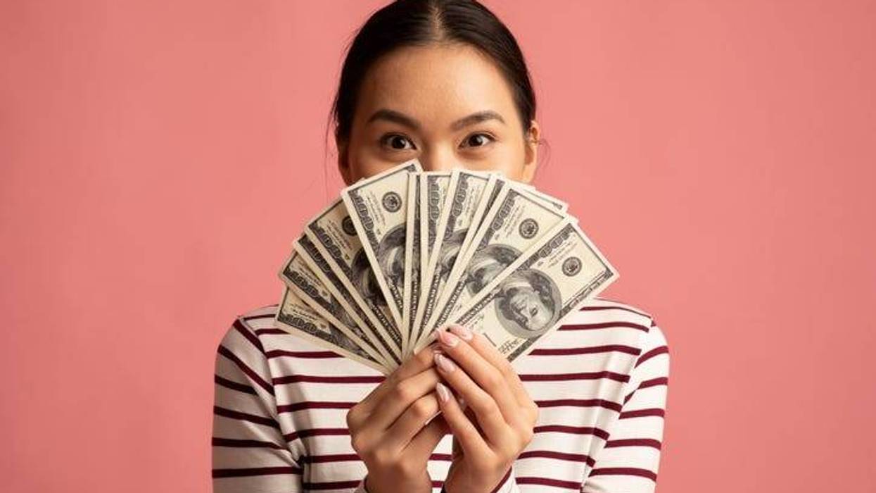 Woman holding money
