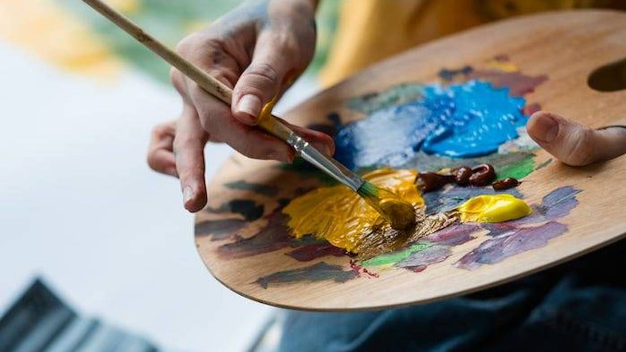 Woman holding paint palette