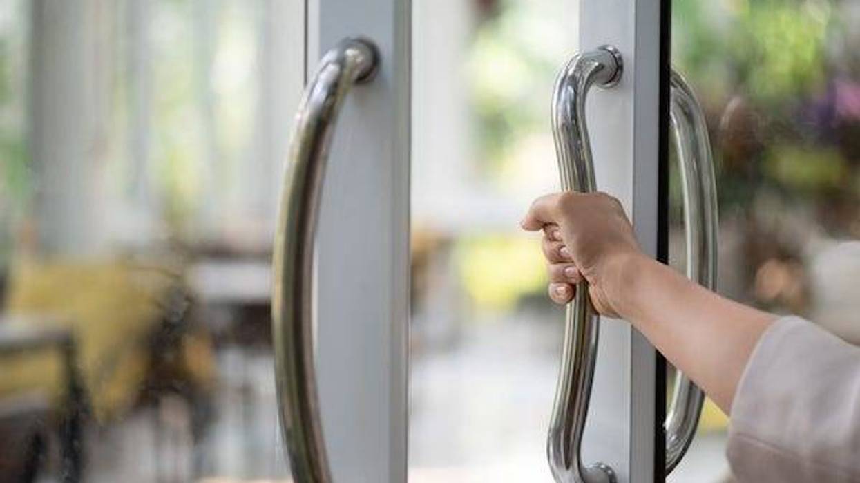 Woman holding the door open