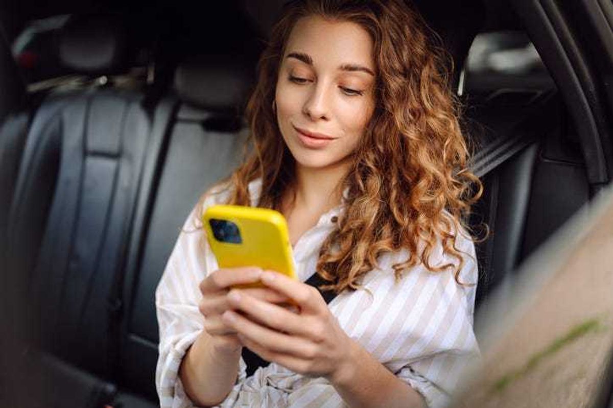 woman in a car on a phone