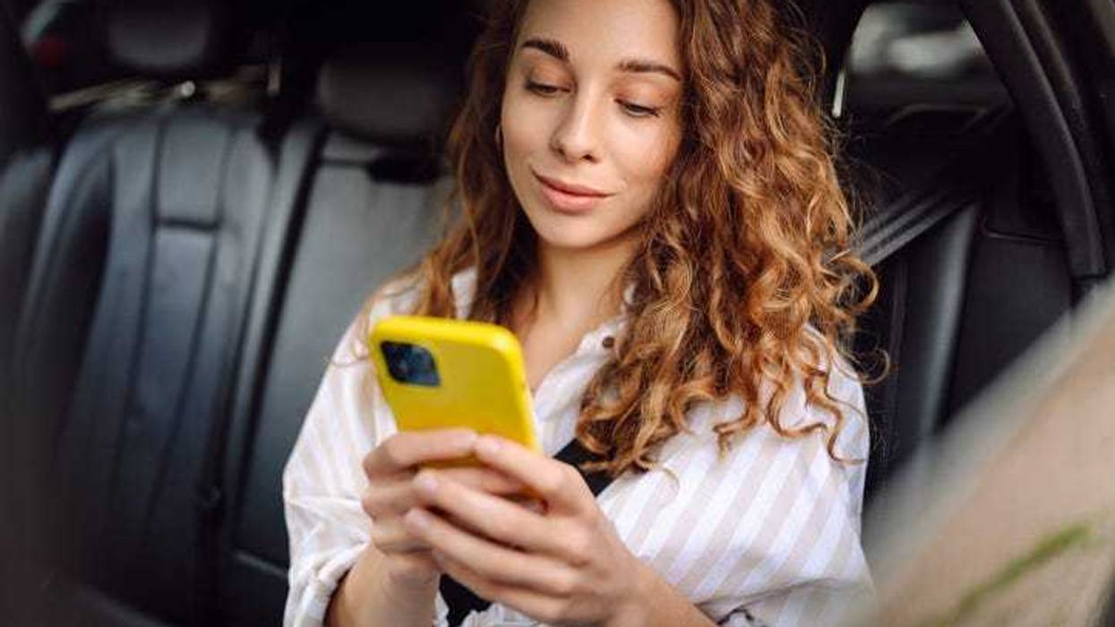 woman in a car on a phone