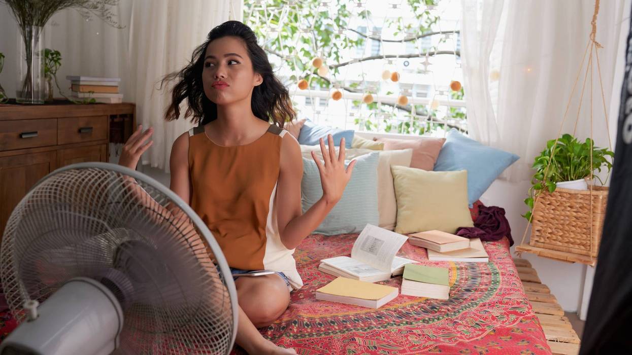 Woman In Front Of Fan