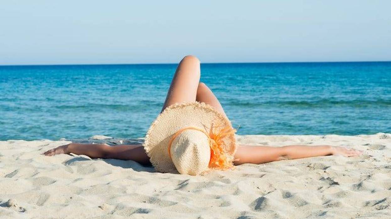 Woman laying out on beach