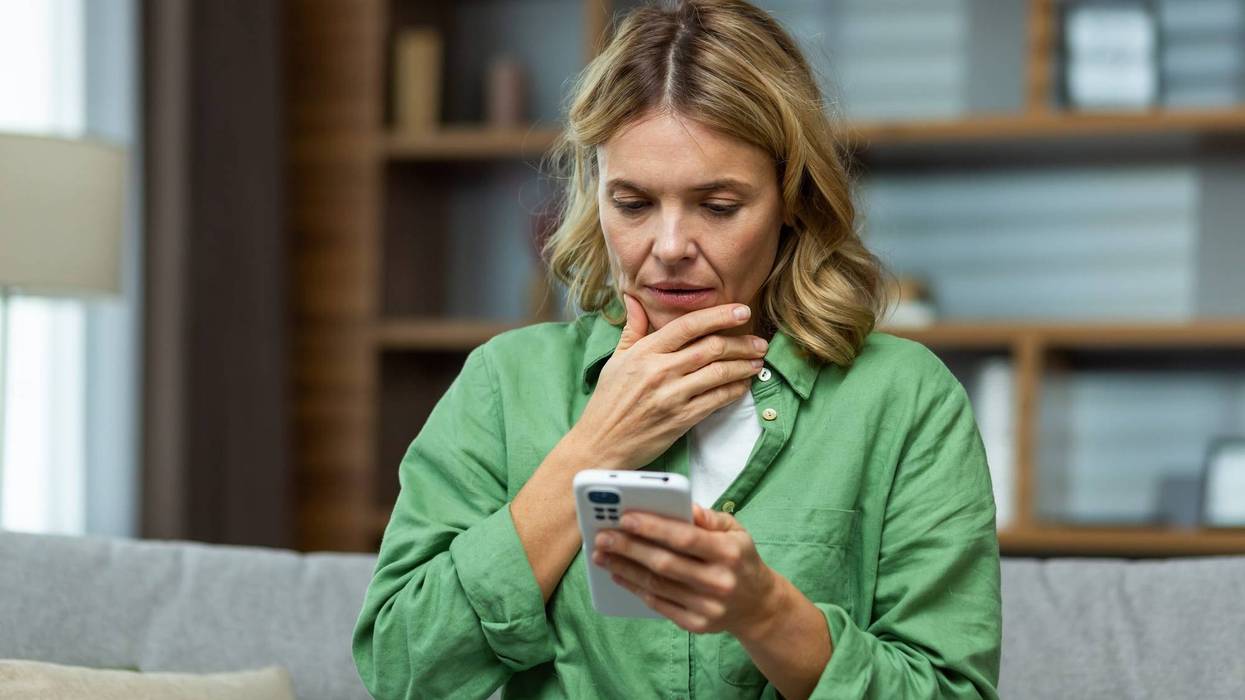 Woman Looking At Her Phone