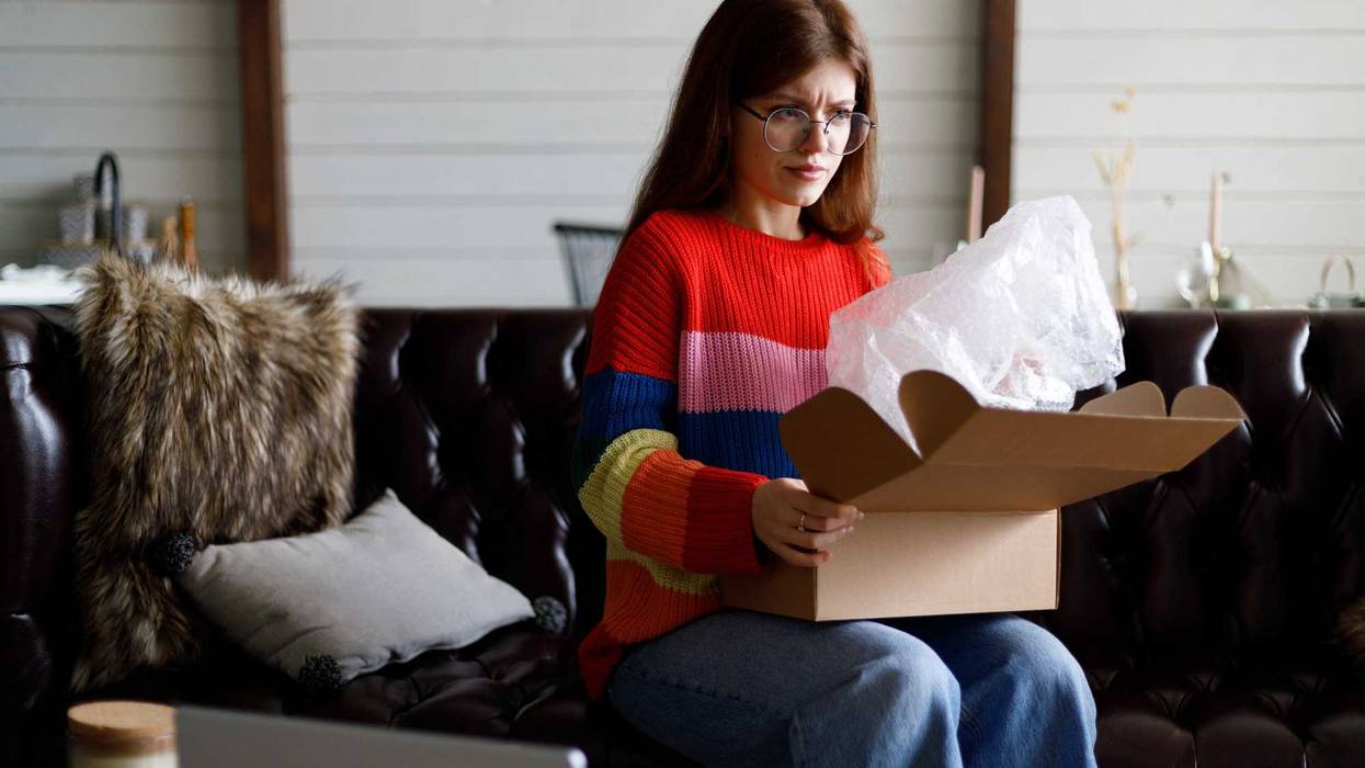 Woman looking dissatisfied with gift.
