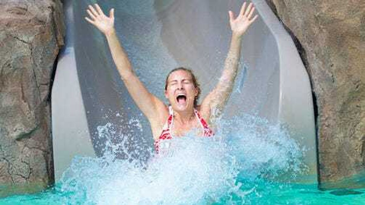 Woman on water slide
