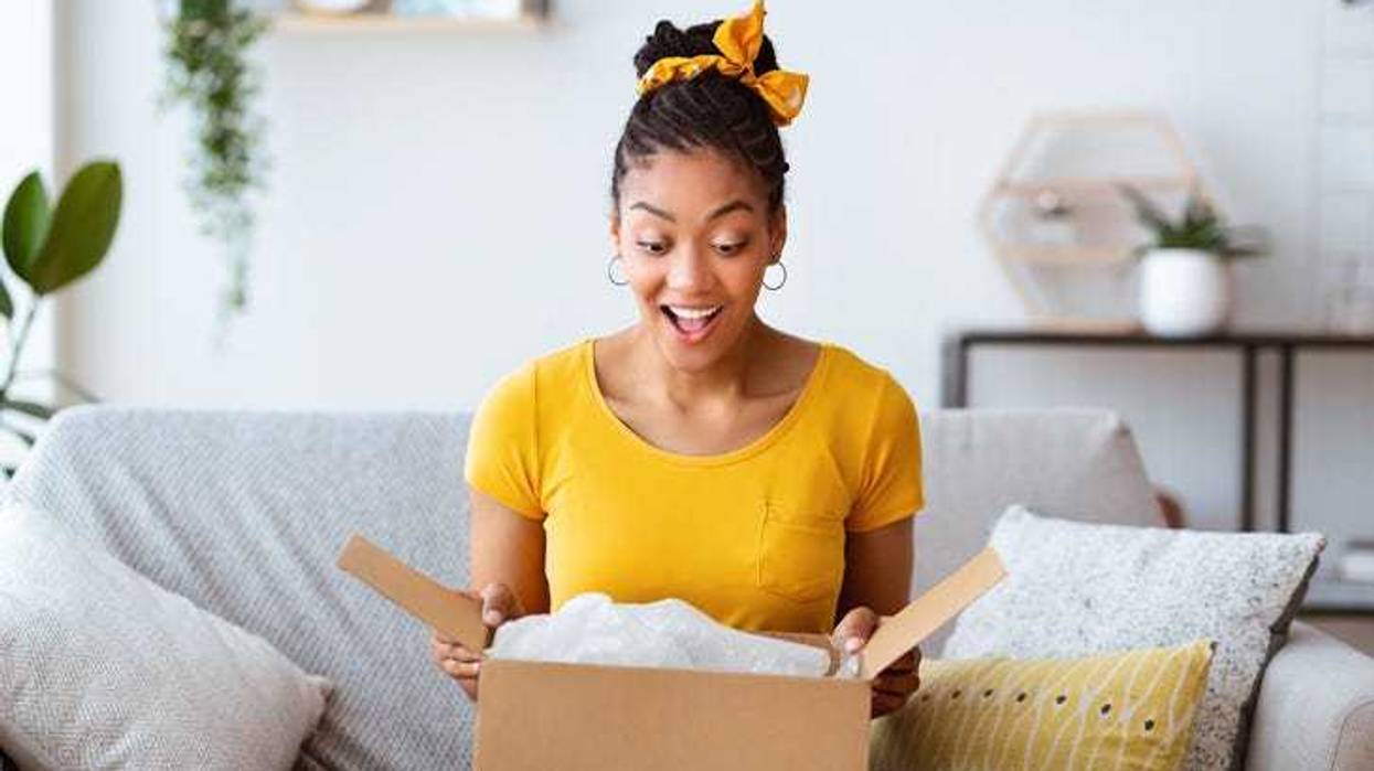 woman opens online shopping package
