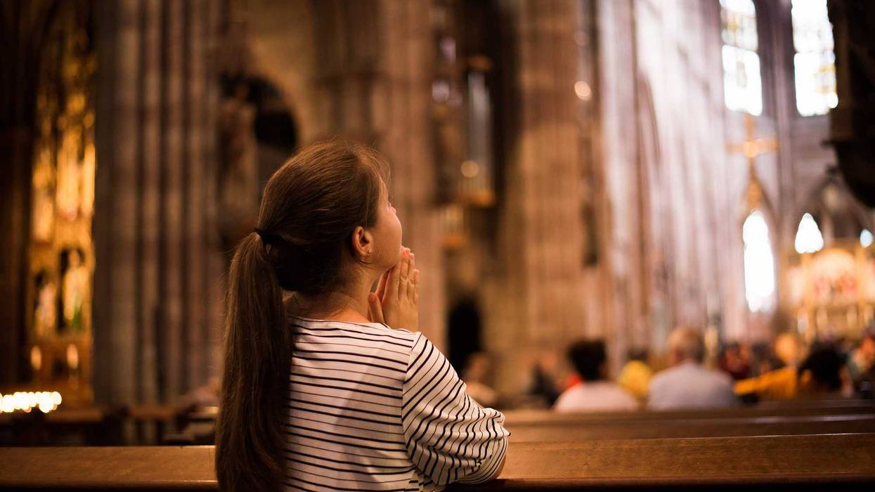 Woman praying at church