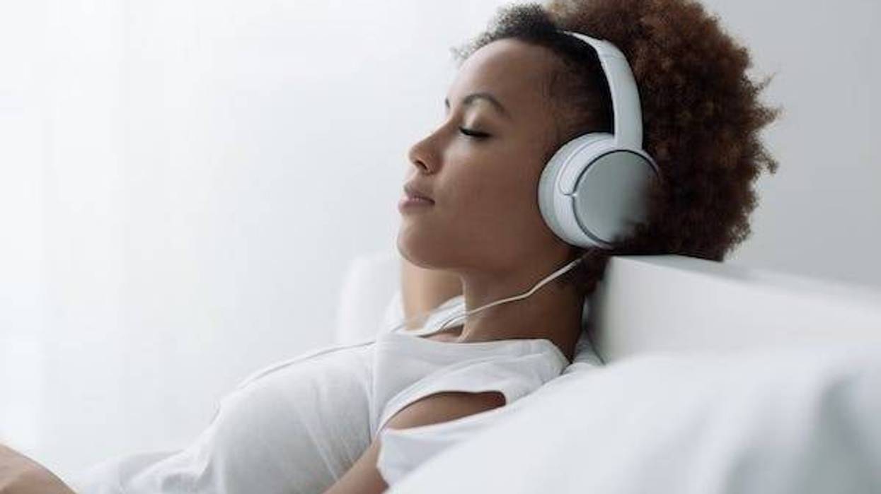 Woman relaxing and listening to music