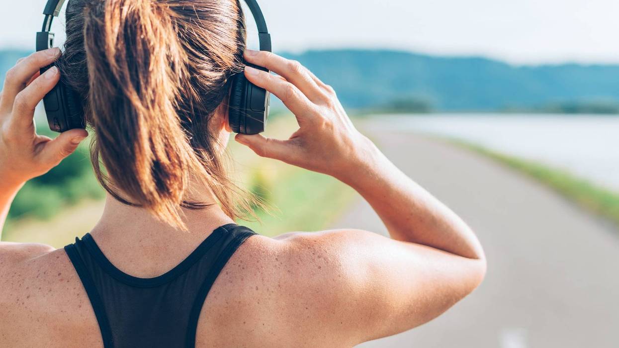 woman running with headphones