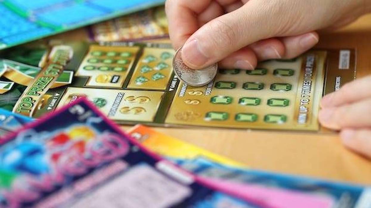 Woman scratching lottery ticket