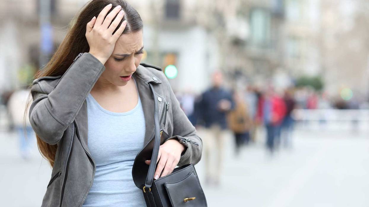 Woman searching for something in her purse.