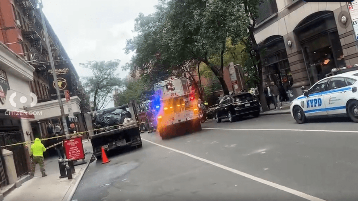 Woman set fires, hurls debris off roof in Midtown