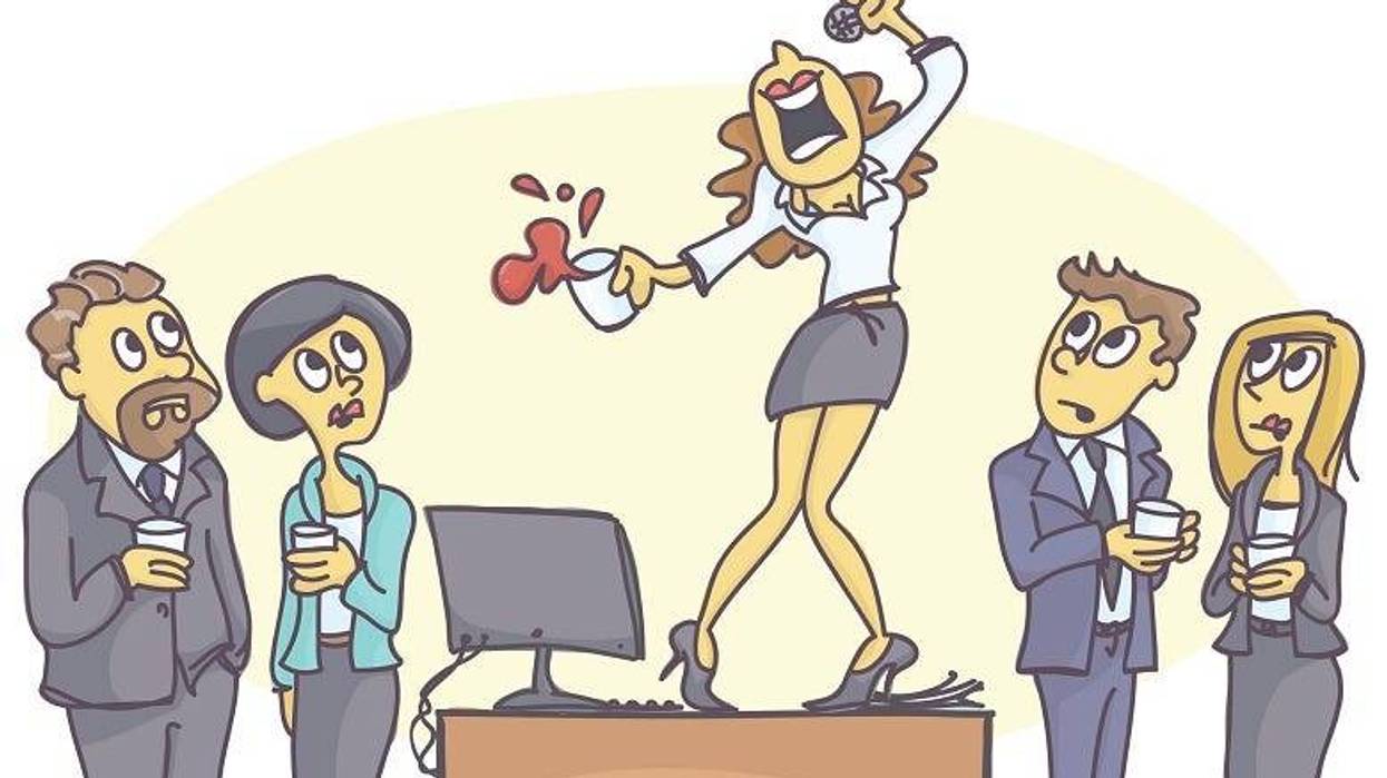 Woman singing on desk at office party