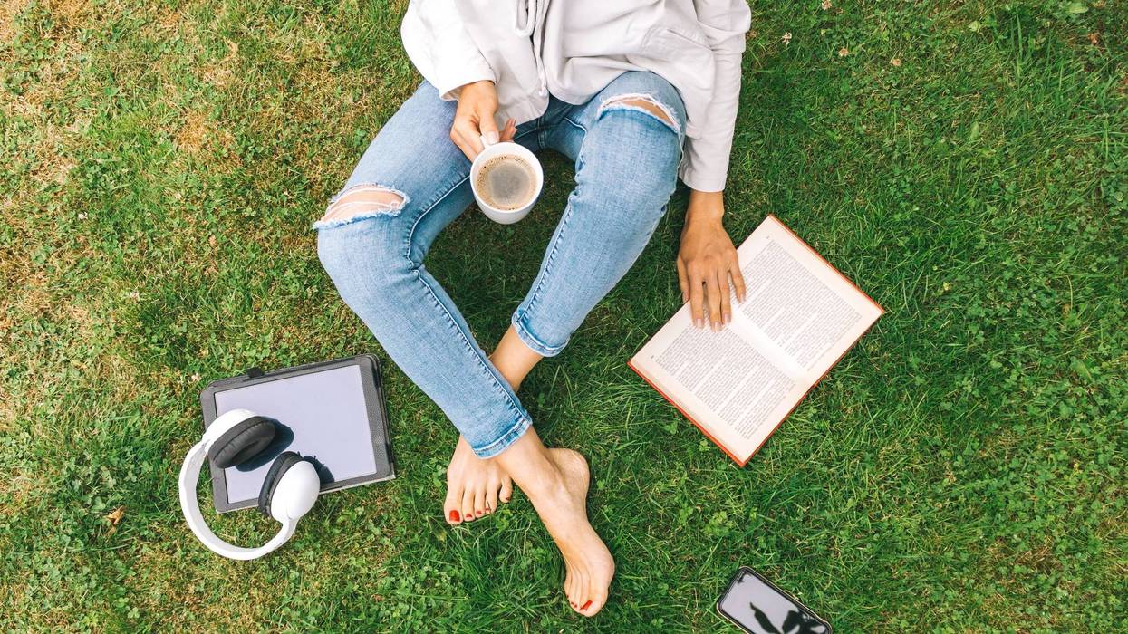 woman sitting in the grass