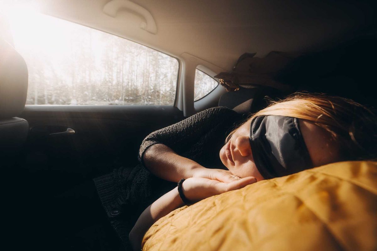 woman sleeping in car