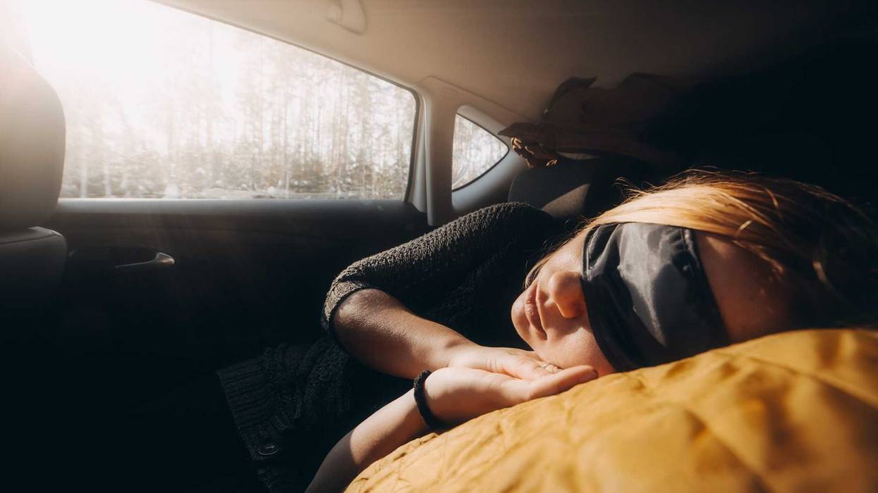 woman sleeping in car