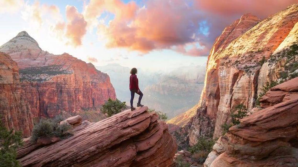 Woman standing on the edge of a cliff