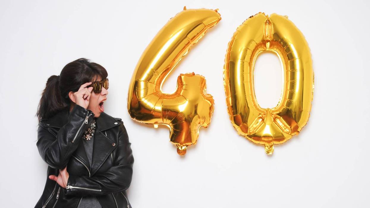 Woman Staring At '40' Balloons