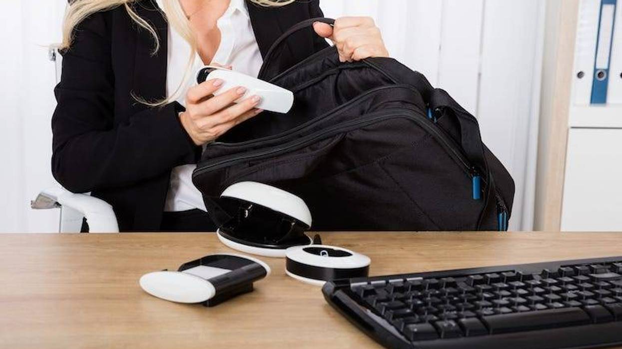 Woman stealing office supplies