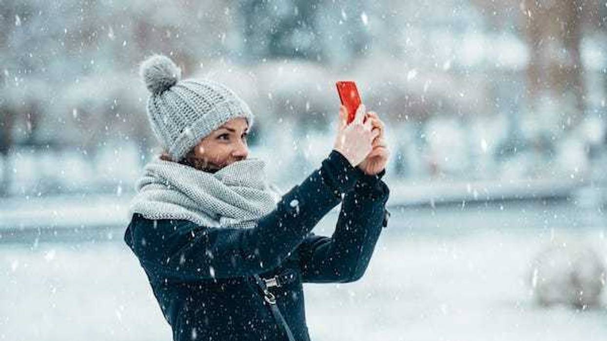 Woman takes a selfie in the snow