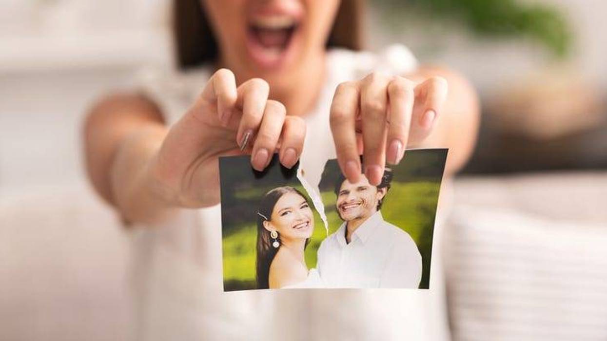 Woman Tearing Apart Photo