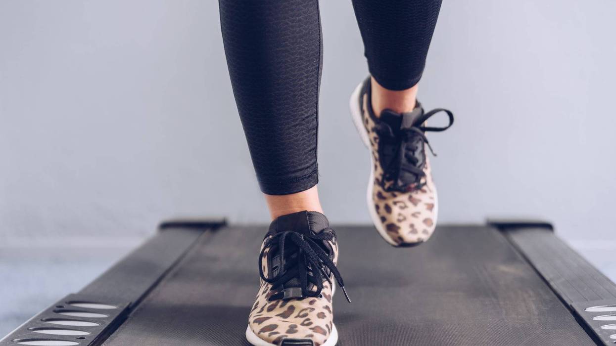 Woman walking on a treadmill.