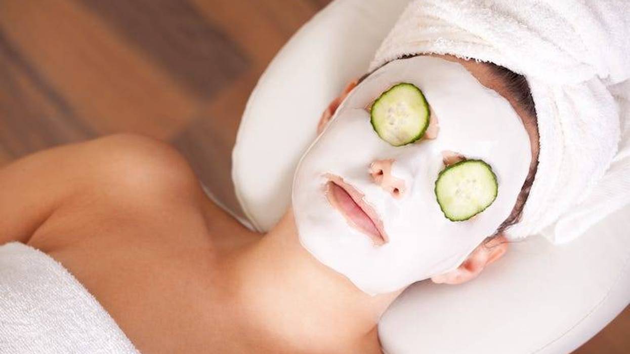 Woman wearing facial mask in spa