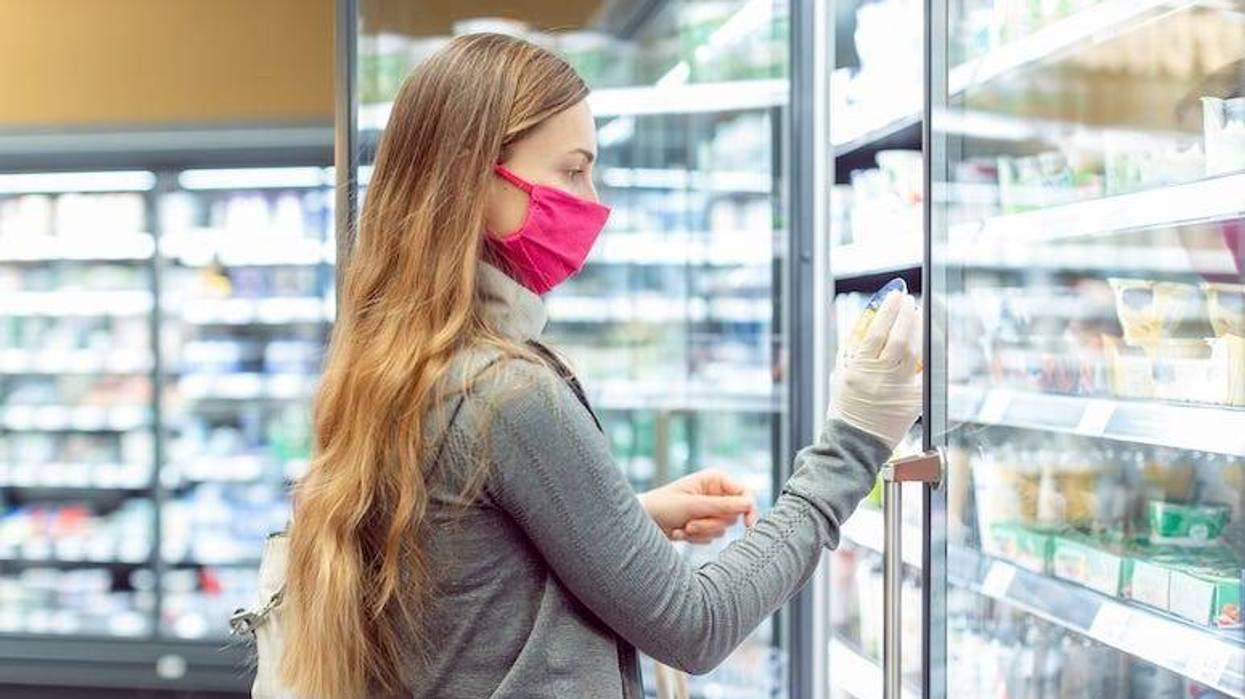 Woman wearing mask while shopping