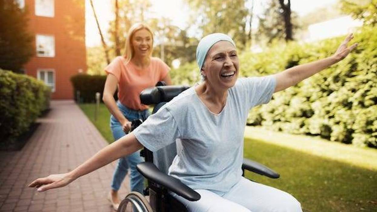 Woman with cancer is sitting in a wheelchair