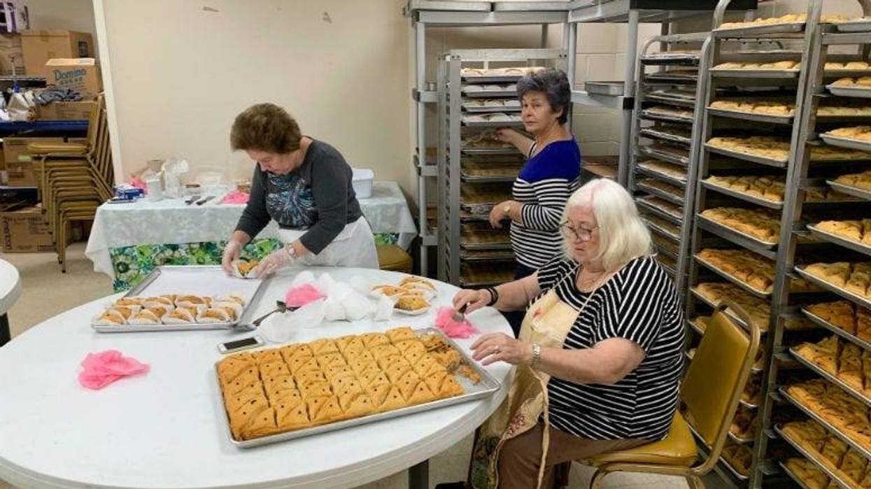 Women baking as they get ready for the Greek Agora Festival in Cherry Hill.