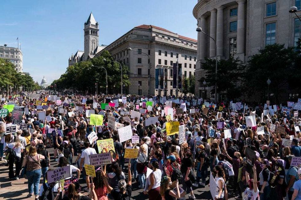 Women rights activists march to the U.S. Capitol during the annual Womens March October 2, 2021 in Washington, DC. The Women