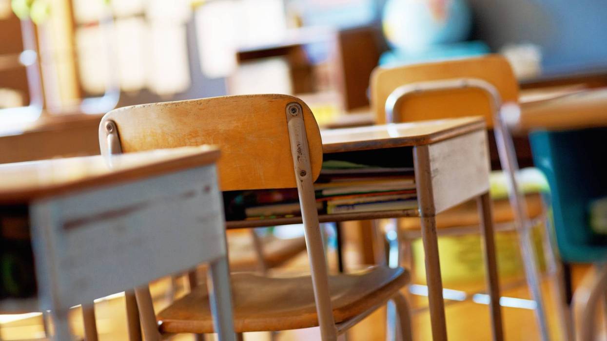 wooden desks in classroom