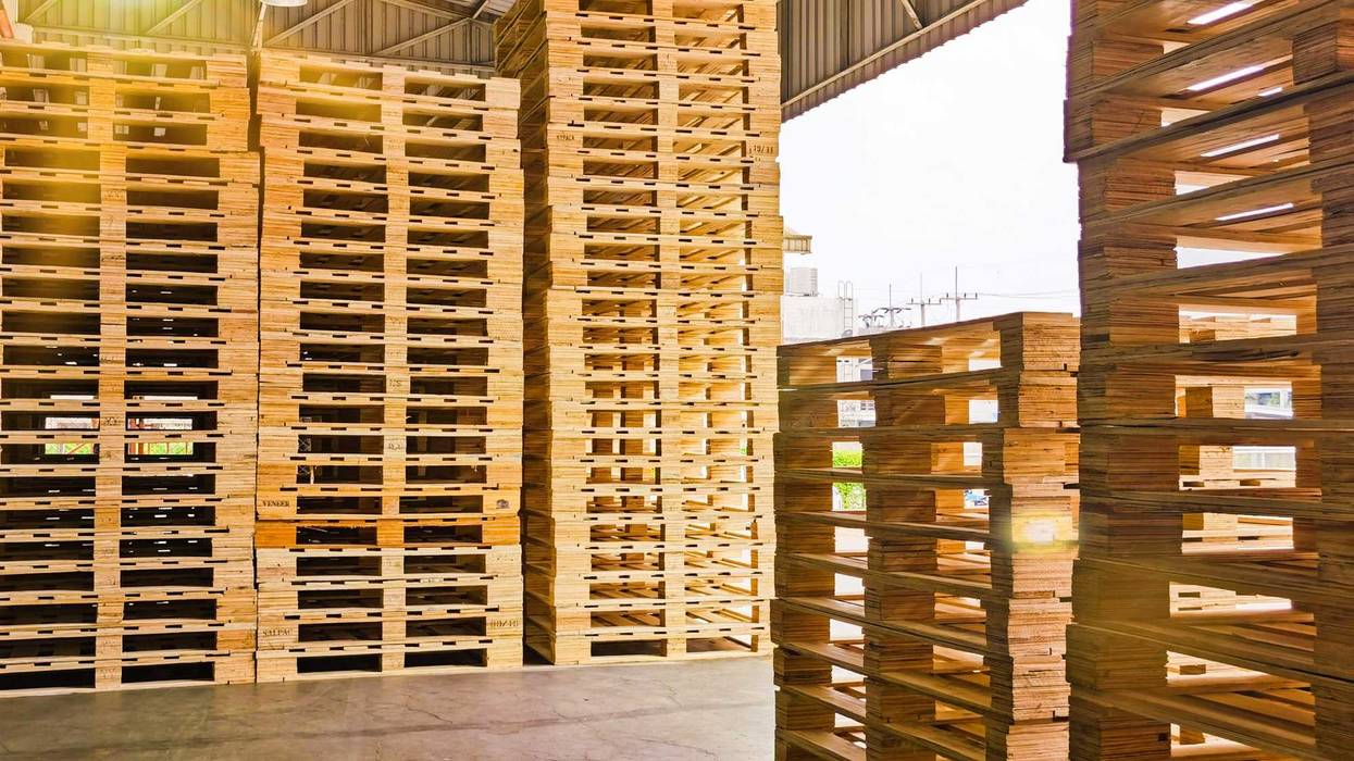 Wooden pallets stack at the freight cargo warehouse