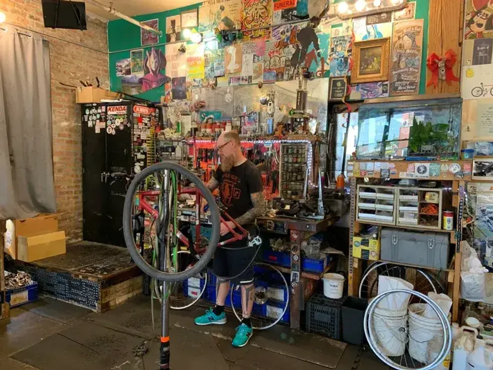 worker repairs a bike