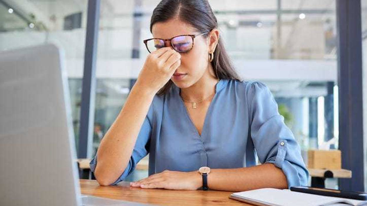 Worker stressed out from their job.