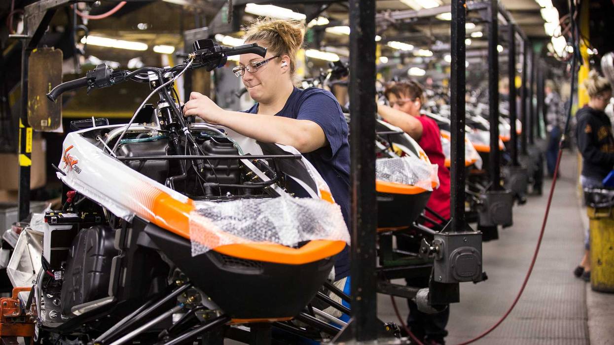 Workers assemble the 2016 Lynx 2000 snowmobile at the Arctic Cat factory in Thief River Falls, Minnesota.