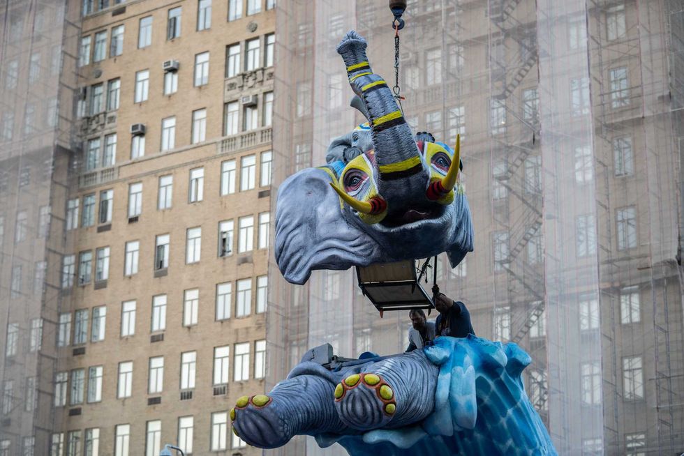 Workers assemble the Kalahari Resorts and Conventions float ahead of the Macy